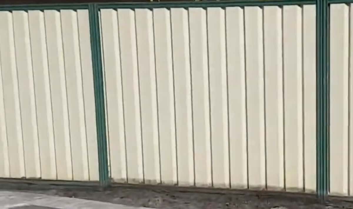 White & green Colorbond fence